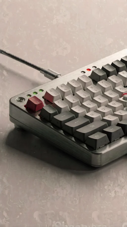Brushed Aluminum Mechanical Keyboard On Warm Gray Surface