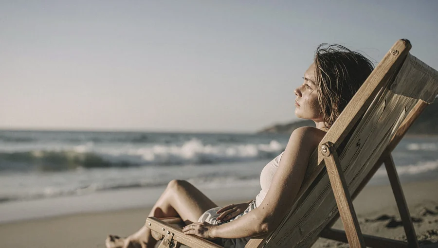 Young Woman Leaning On Beach Chair