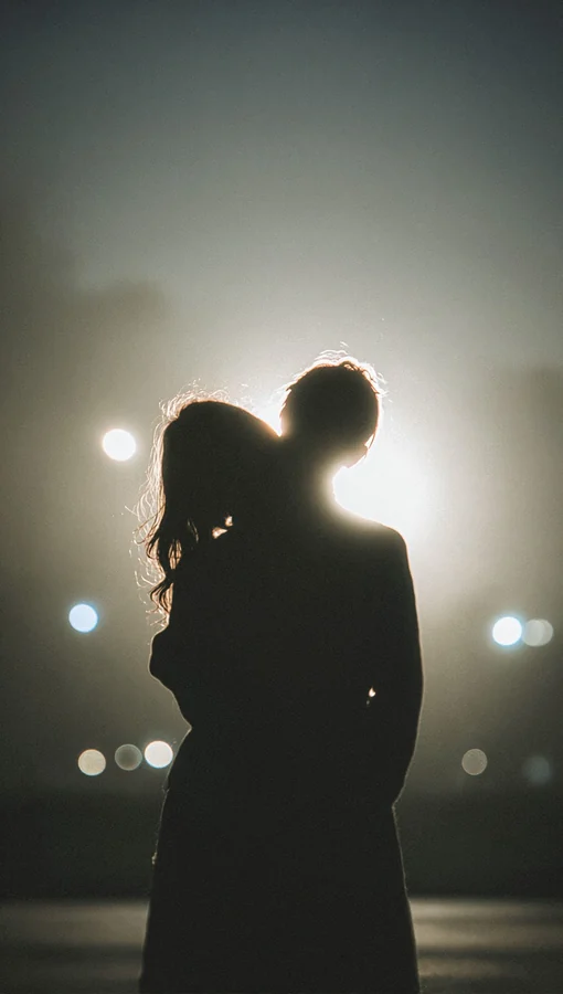 Black Two Silhouetted Figures Embrace Closely